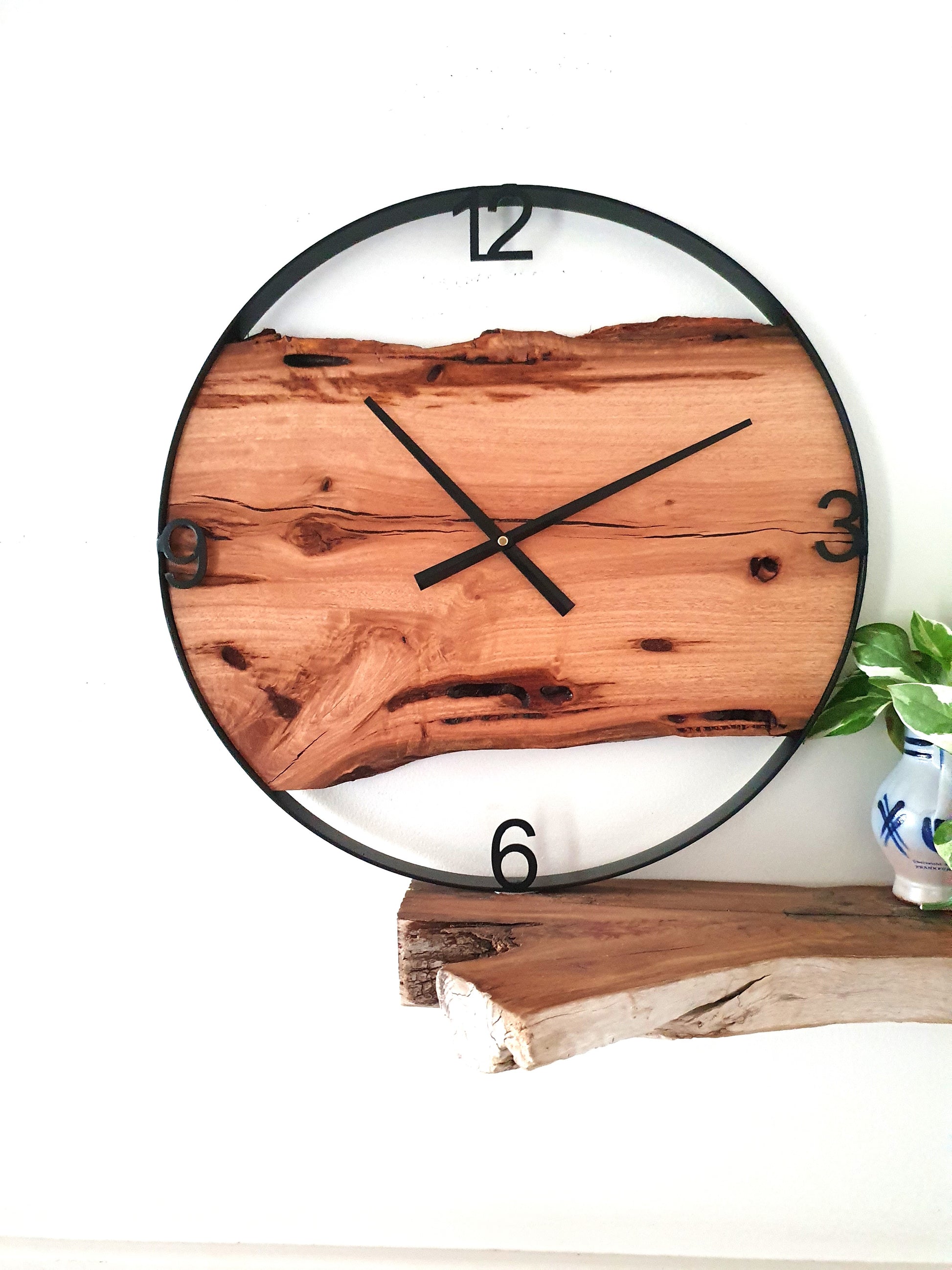Custom made Wooden wall clock with natural finish on a white background